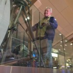 guy standing behind glass